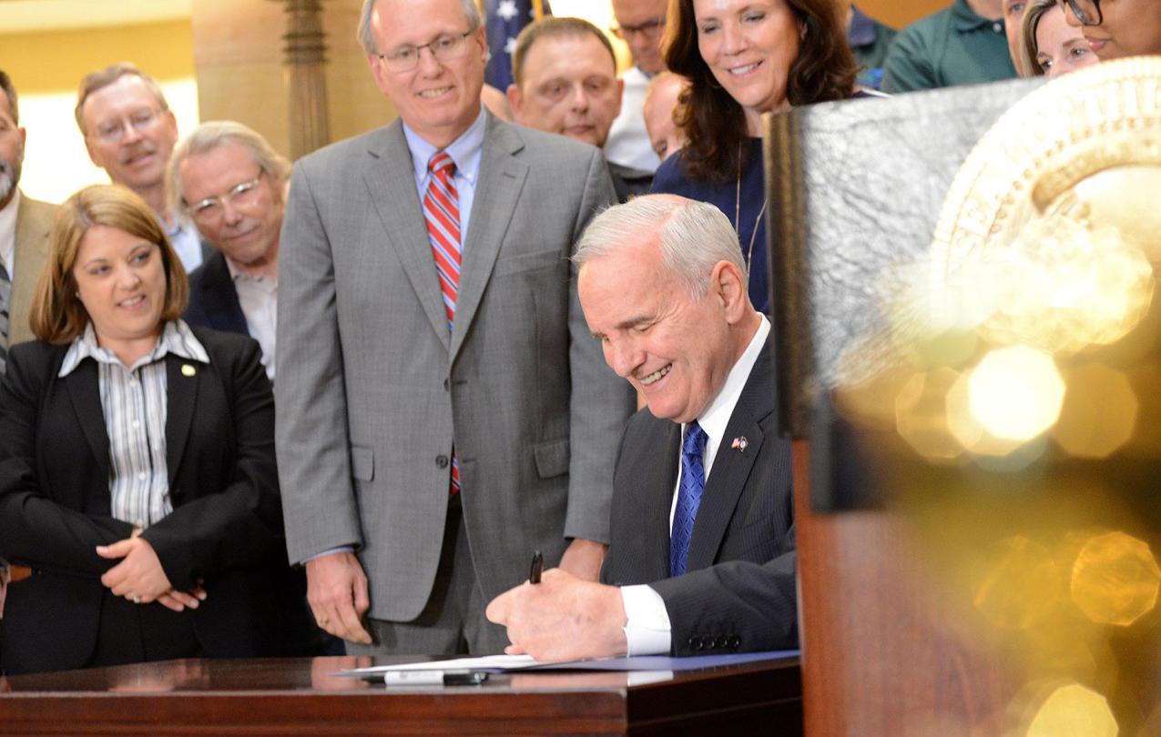 Governor Dayton makes history by signing the 2018 Omnibus Pension Bill into law